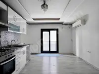 Bostanlı'da satılık 2+1 daire · fotoğraf 1